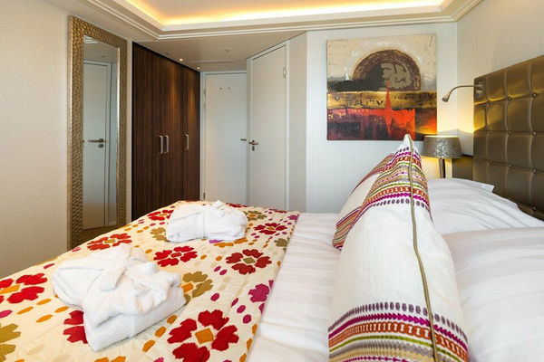 AmaWaterways AmaFiora Category CA Stateroom Bedroom WEB.png